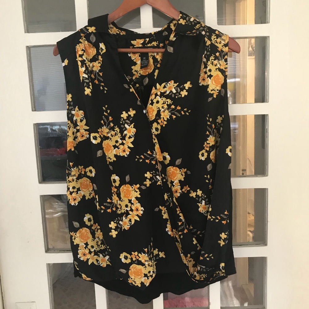 Sleeveless blouse with wrap styling